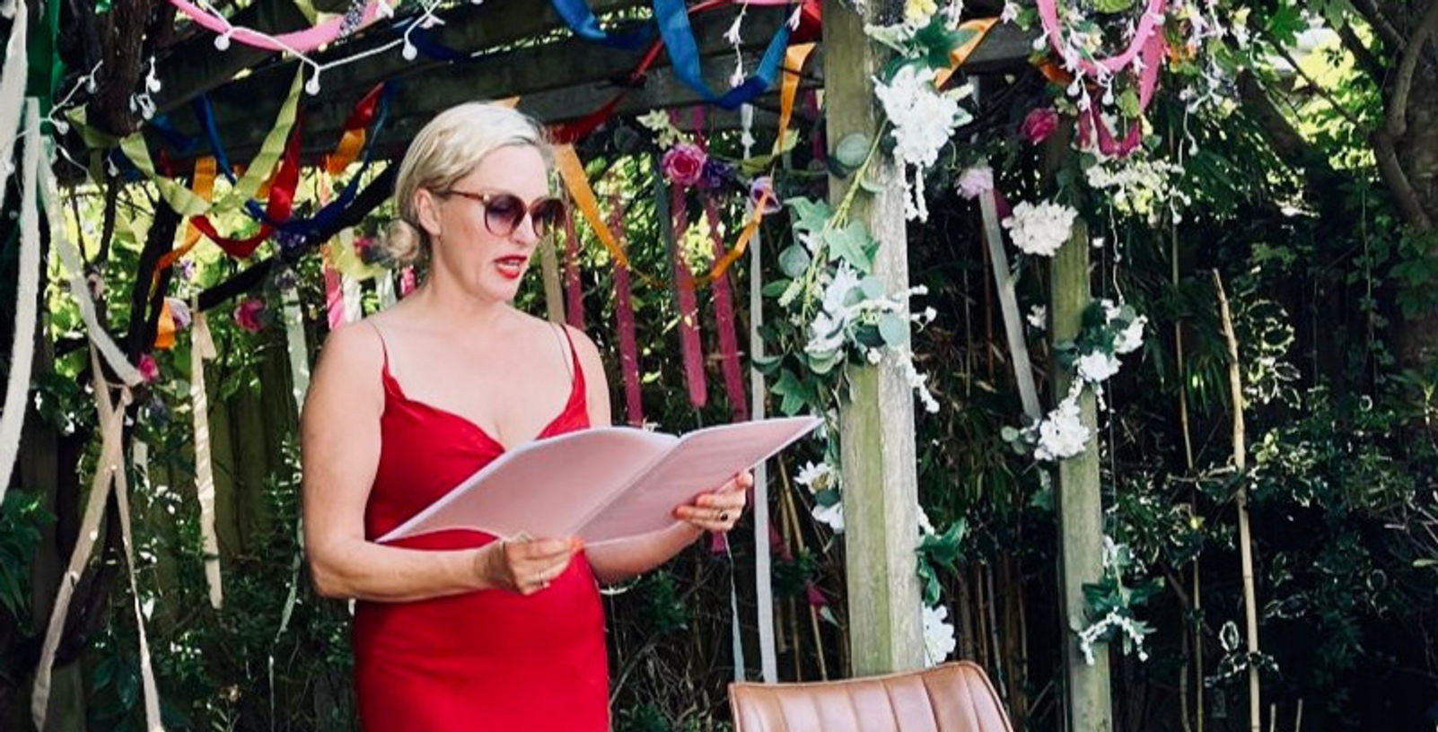 Bryony leading an outdoor garden wedding ceremony