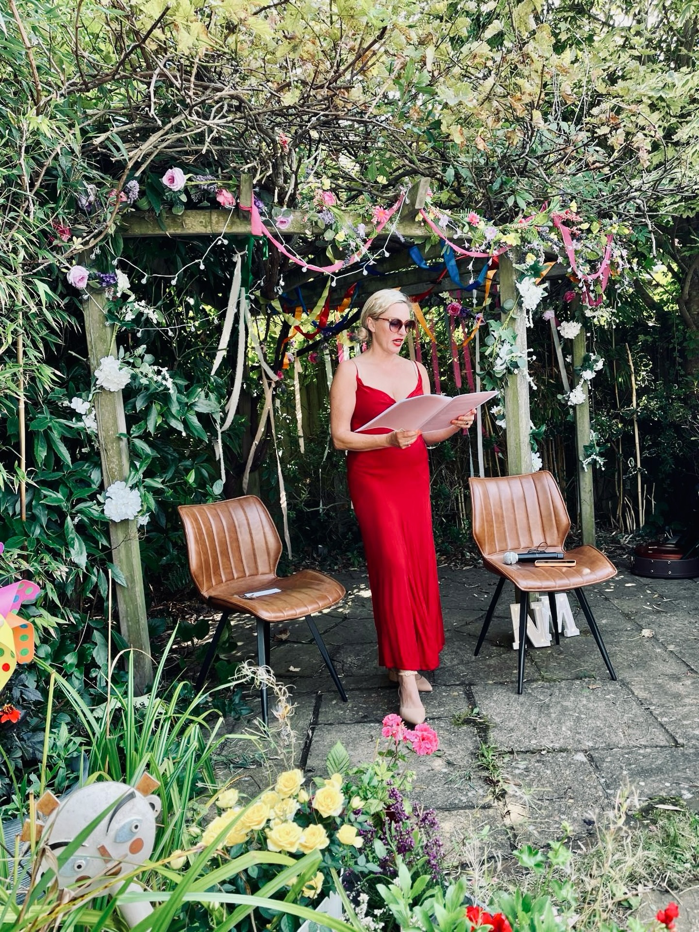 Bryony standing ready to lead a garden wedding ceremony